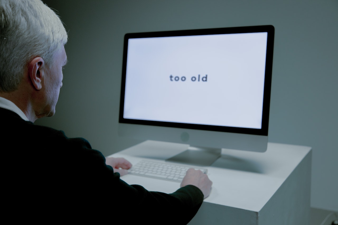 Older man is using pc that say too old